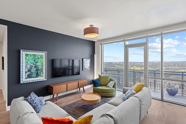 222 W Ave Unit 2806, Austin, TX 78701 - living area featuring wood finished floors, baseboards, and floor to ceiling windows