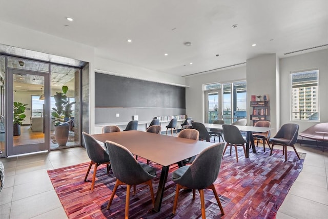 dining room featuring light tile patterned floors and recessed lighting