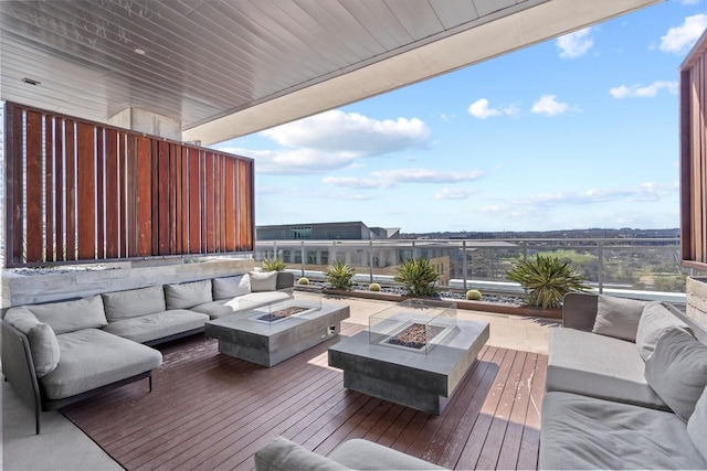 222 W Ave Unit 2806, Austin, TX 78701 - wooden deck with an outdoor living space with a fire pit