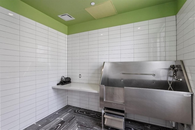 222 W Ave Unit 2806, Austin, TX 78701 - misc room featuring pet washing station and tile walls