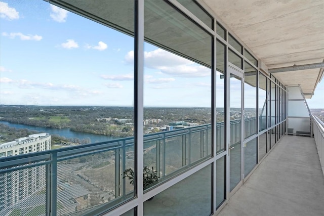 balcony featuring a water view