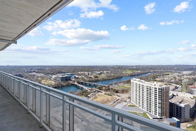 balcony with a view of city and a water view