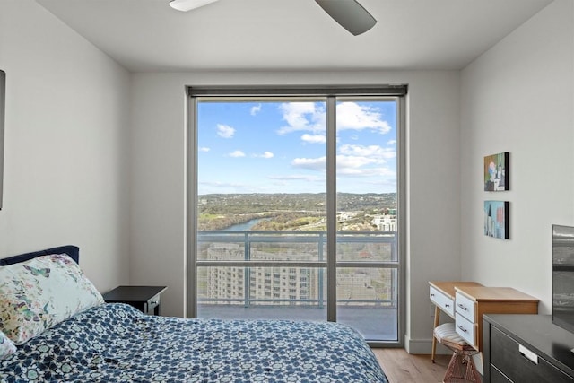 bedroom with light wood-style floors and ceiling fan