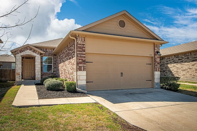 view of front of home with a garage, brick siding, and driveway