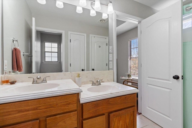 bathroom featuring tile patterned floors and vanity