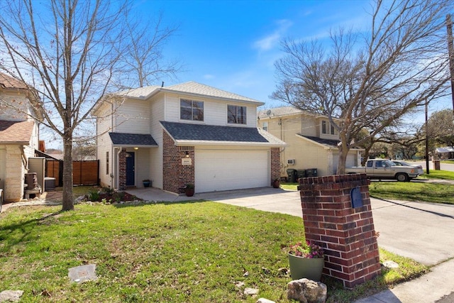 traditional home with brick siding, an attached garage, fence, a front yard, and driveway