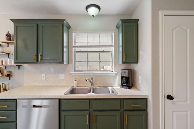 kitchen with a sink, backsplash, stainless steel dishwasher, light countertops, and green cabinetry