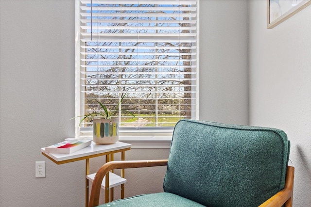 sitting room featuring a textured wall