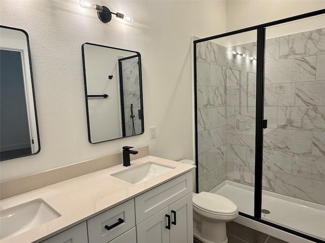 full bathroom featuring a stall shower and a sink