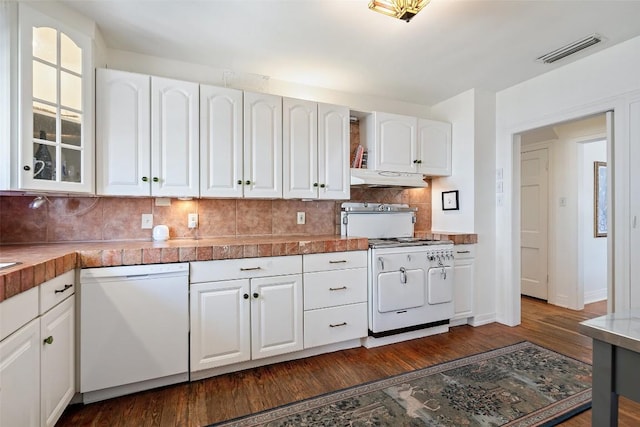 kitchen with visible vents, white appliances, dark wood-style flooring, and white cabinetry