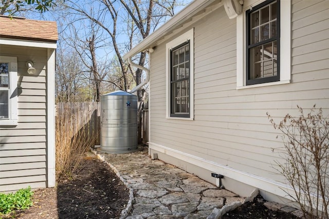 view of property exterior featuring fence