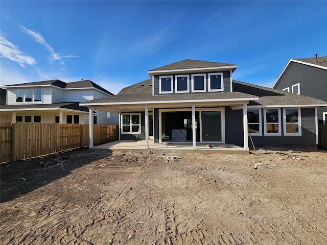 back of house with a patio and fence