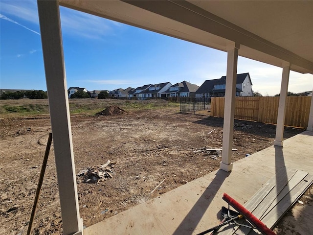 view of yard with fence and a residential view