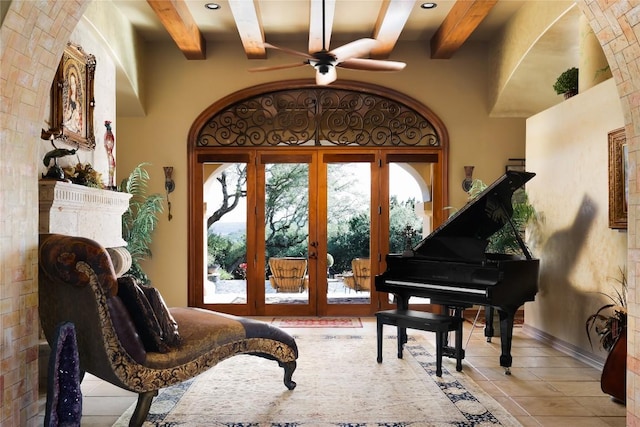 living area featuring beam ceiling, french doors, tile patterned floors, and ceiling fan