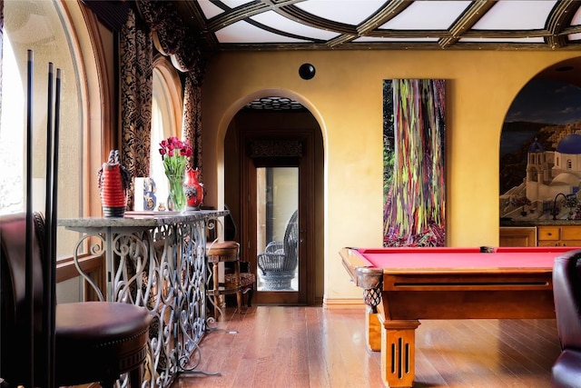 recreation room with an ornate ceiling, arched walkways, wood finished floors, and billiards