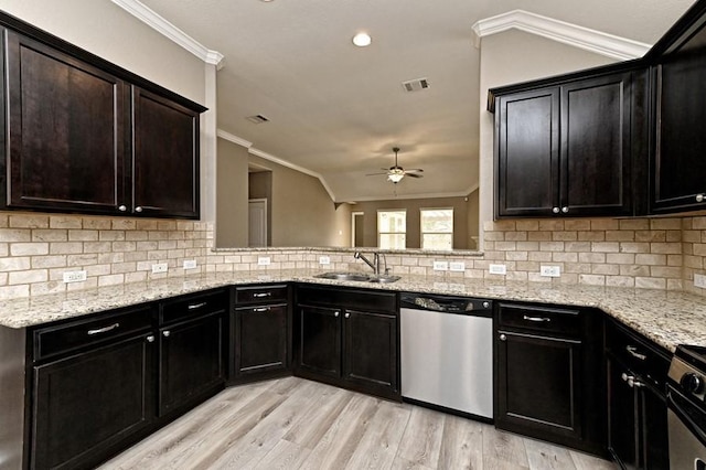 kitchen featuring crown molding, visible vents, appliances with stainless steel finishes, and a sink