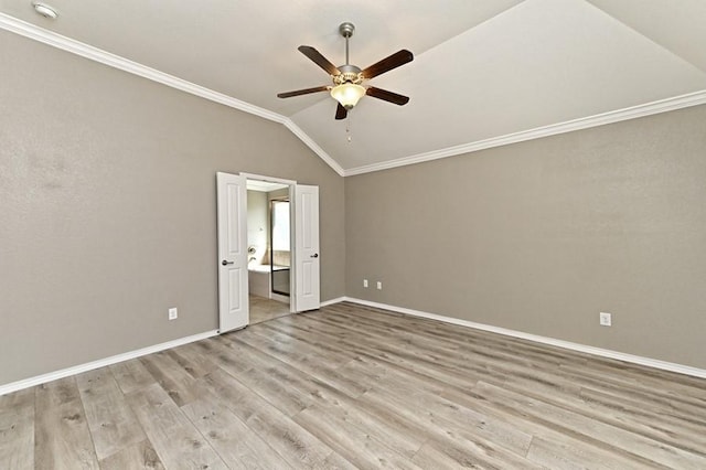 unfurnished bedroom with light wood finished floors, baseboards, lofted ceiling, and ornamental molding