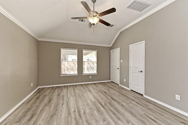 unfurnished room featuring light wood-type flooring, visible vents, and ornamental molding