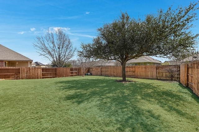 view of yard featuring a fenced backyard