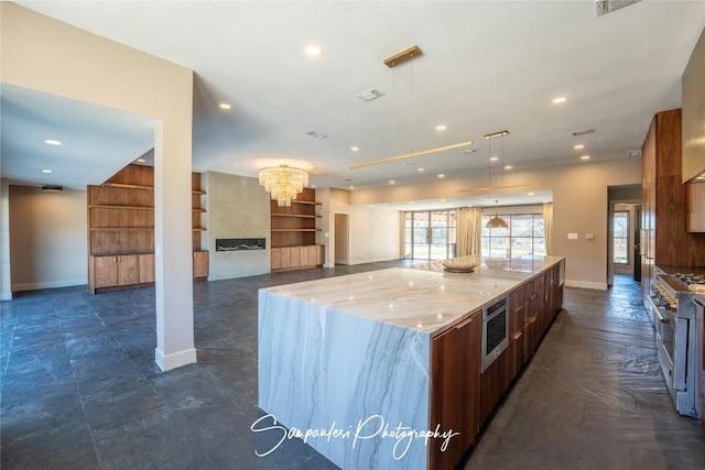 kitchen with modern cabinets, appliances with stainless steel finishes, and recessed lighting