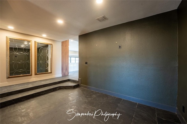 unfurnished room with recessed lighting, baseboards, visible vents, and marble finish floor