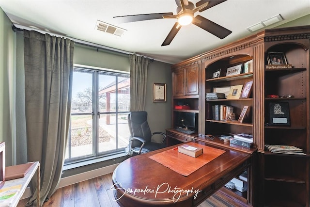 office area featuring wood finished floors, visible vents, and ceiling fan