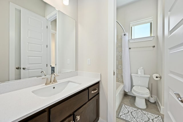 bathroom with tile patterned flooring, baseboards, toilet, shower / tub combo, and vanity