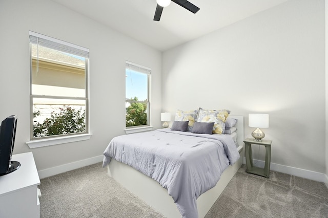 bedroom featuring baseboards, ceiling fan, and carpet flooring