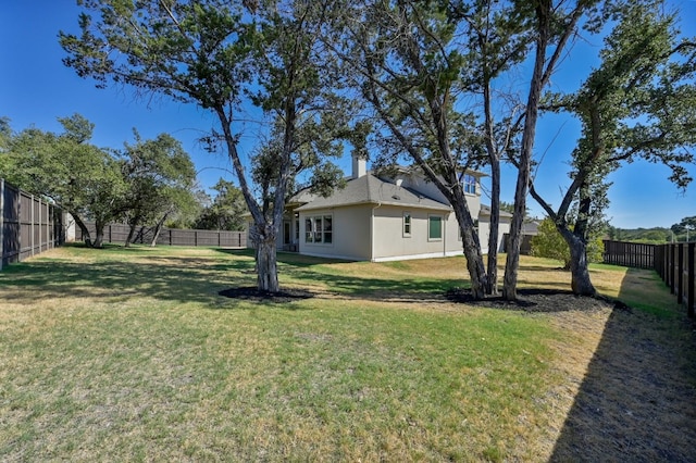 view of yard featuring a fenced backyard