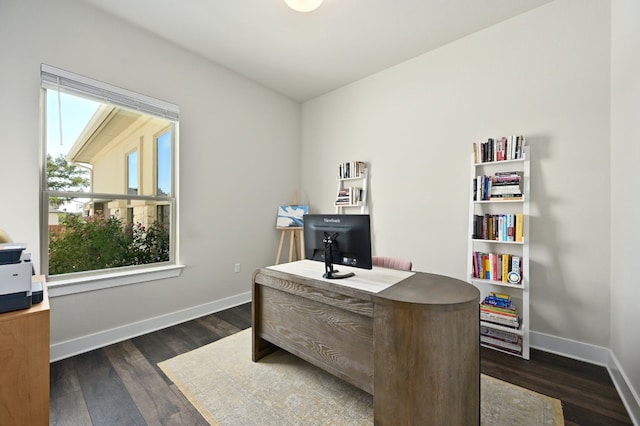 office space with baseboards and dark wood-style flooring