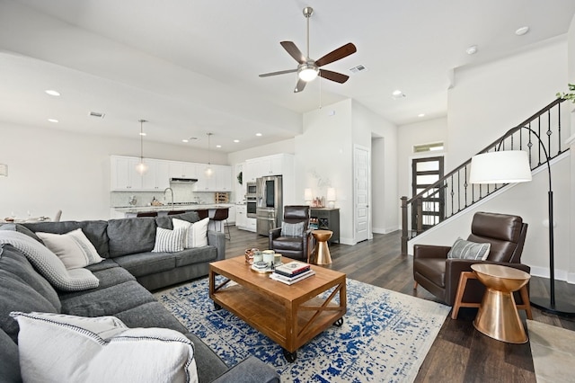 living room featuring visible vents, dark wood-style floors, recessed lighting, stairway, and ceiling fan