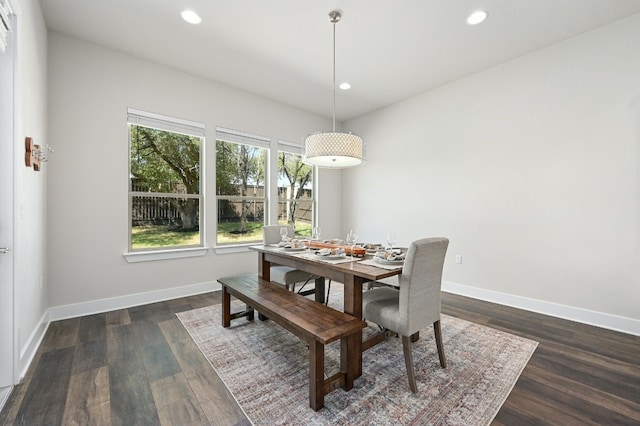 dining space with dark wood-type flooring, recessed lighting, and baseboards