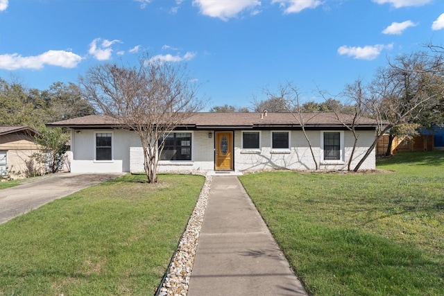 single story home with a front lawn and brick siding