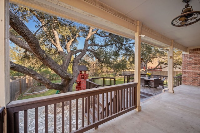 exterior space with fence private yard, outdoor dining space, and a playground