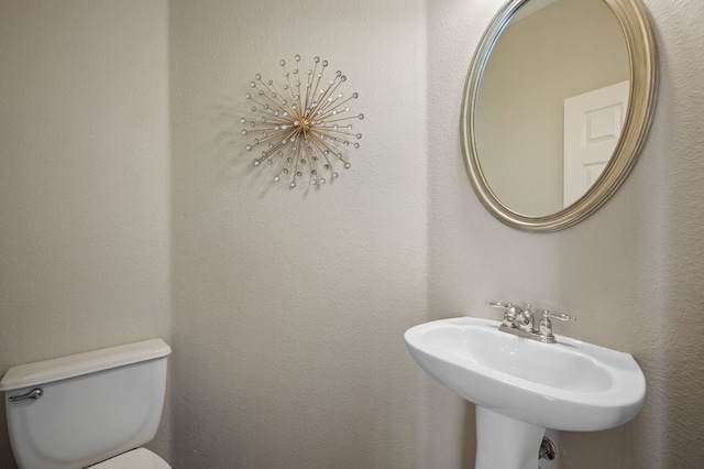 bathroom with a sink and toilet