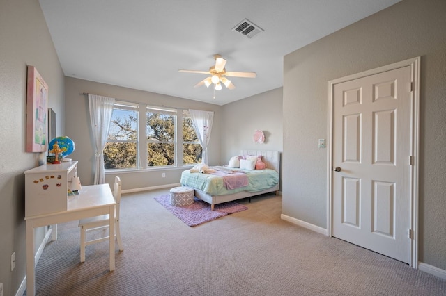 bedroom with carpet flooring, baseboards, visible vents, and ceiling fan