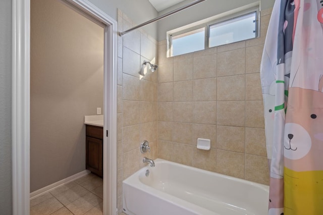 bathroom featuring tile patterned floors, baseboards, shower / tub combo with curtain, and vanity