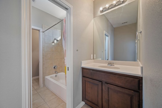 bathroom featuring tile patterned floors, visible vents, shower / bathtub combination, and vanity