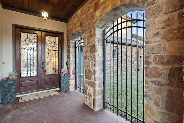 12500 Verandah Ct, Austin, TX 78726 - entrance to property with stone siding, french doors, and a gate