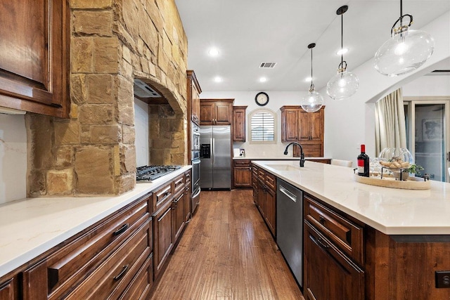 12500 Verandah Ct, Austin, TX 78726 - kitchen with stainless steel appliances, a large island, dark wood-type flooring, decorative light fixtures, and recessed lighting