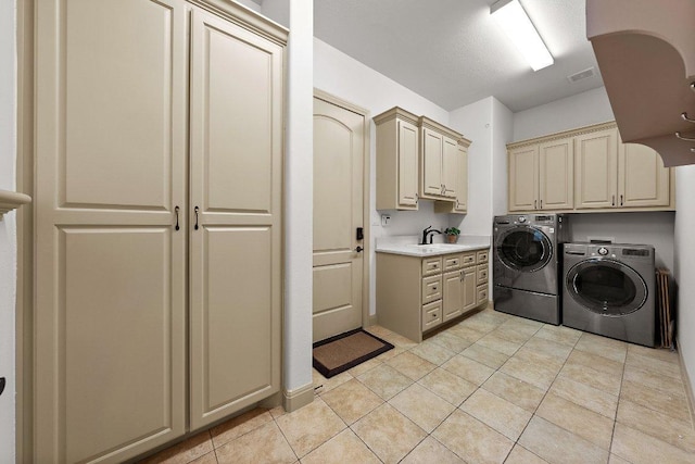 12500 Verandah Ct, Austin, TX 78726 - washroom with cabinet space, washing machine and dryer, and light tile patterned floors