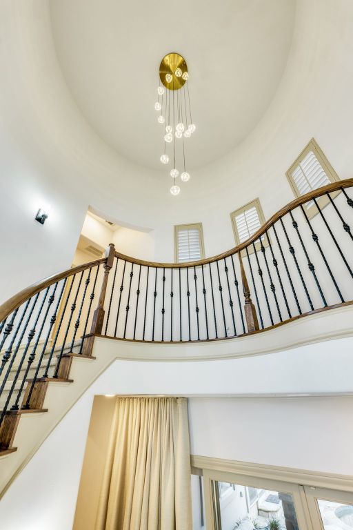 stairway with a towering ceiling