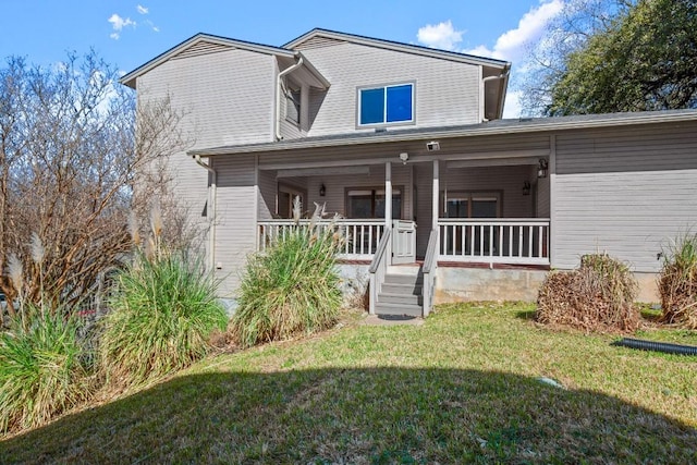 view of front facade featuring a porch and a front lawn