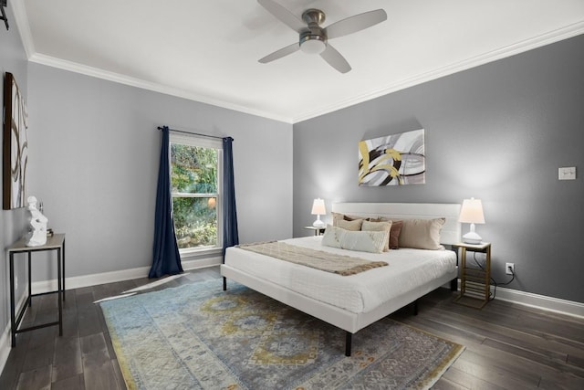 bedroom with ornamental molding, a ceiling fan, baseboards, and hardwood / wood-style flooring