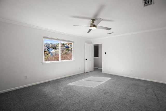 carpeted empty room with visible vents, baseboards, a ceiling fan, and crown molding