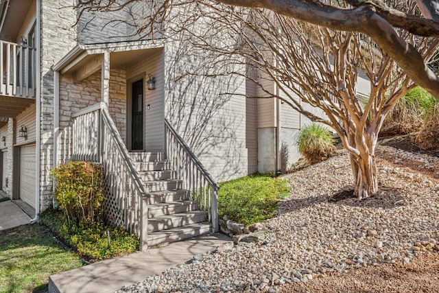 view of exterior entry with stone siding