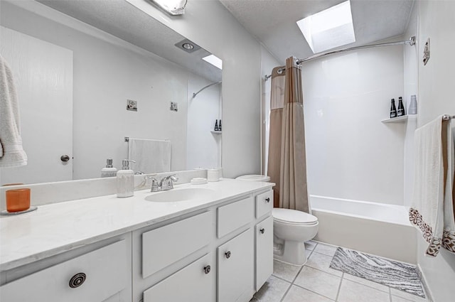 full bath with toilet, a skylight, shower / tub combo, tile patterned floors, and vanity