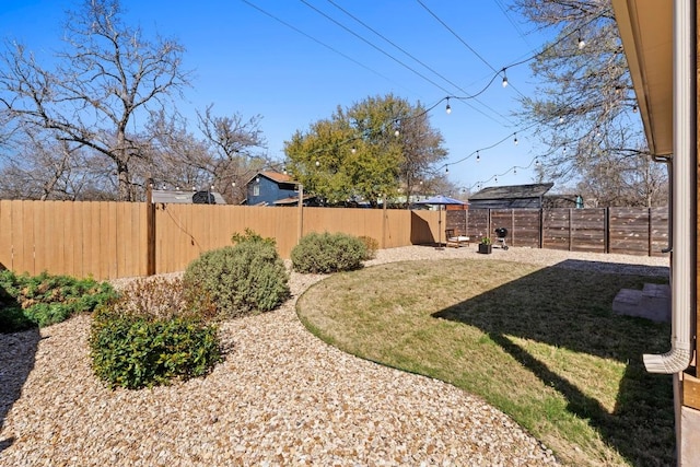 view of yard featuring a fenced backyard