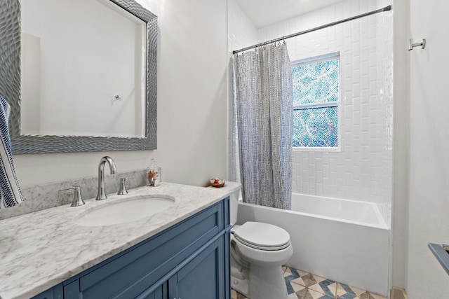 bathroom featuring vanity, tile patterned floors, shower / tub combo, and toilet