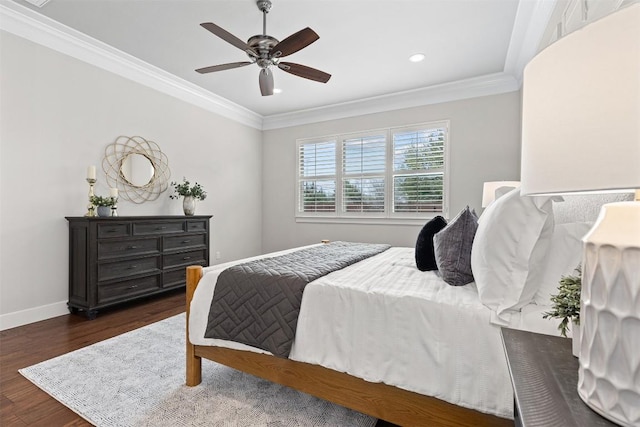 bedroom with wood finished floors, recessed lighting, crown molding, baseboards, and ceiling fan